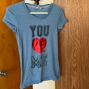 Victoria’s Secret tee.